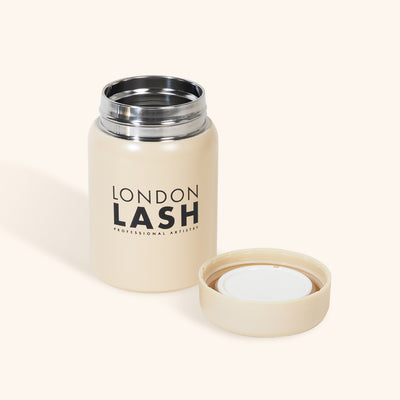 Beige lash extension glue container to help glue lash longer