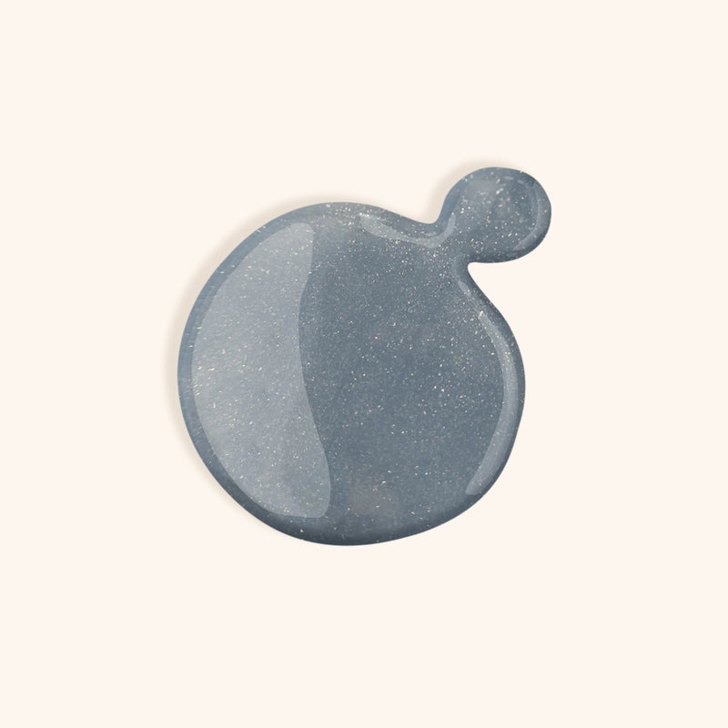 Denim glittery blue nail polish with turquoise hue