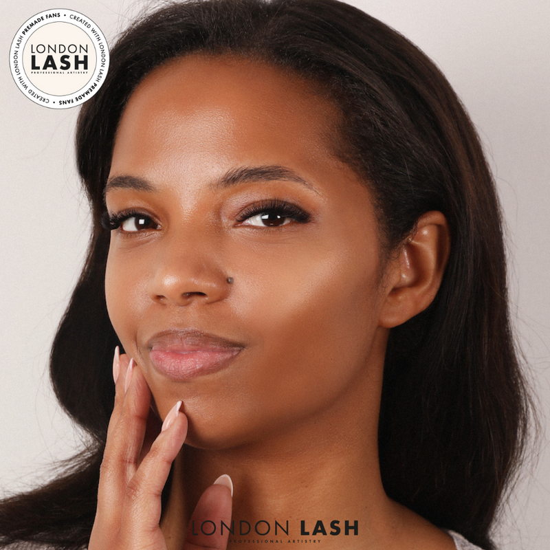 Dark haired woman wearing eyelash extensions