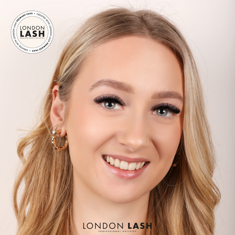 Woman with blonde hair wearing eyelash extensions