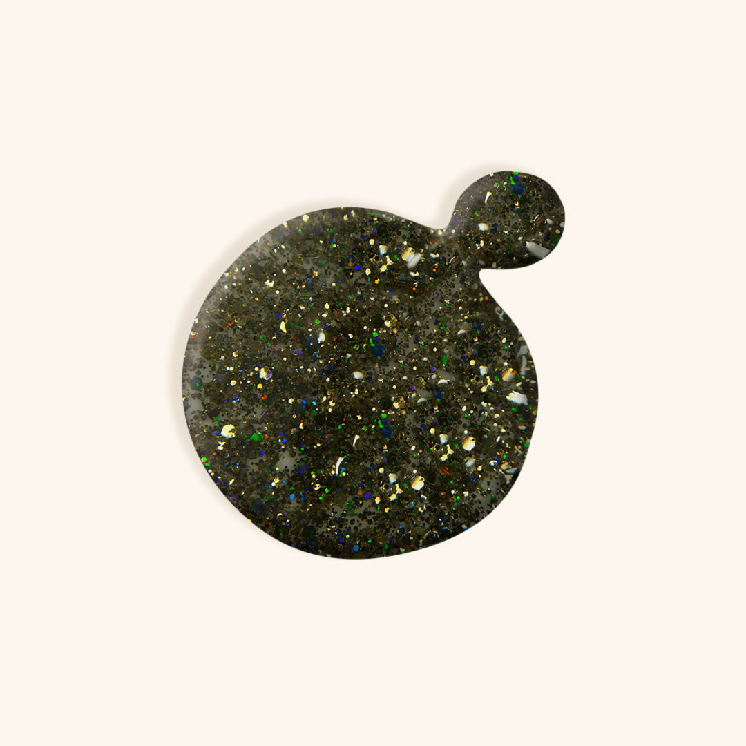 Dark silver glitter nail polish with a brown tone