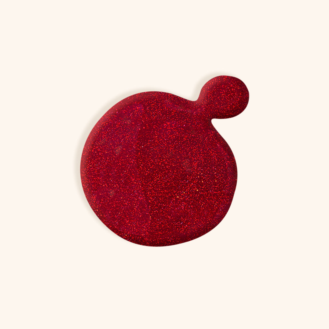 Deep red with hints of orange and glitter gel nail polish