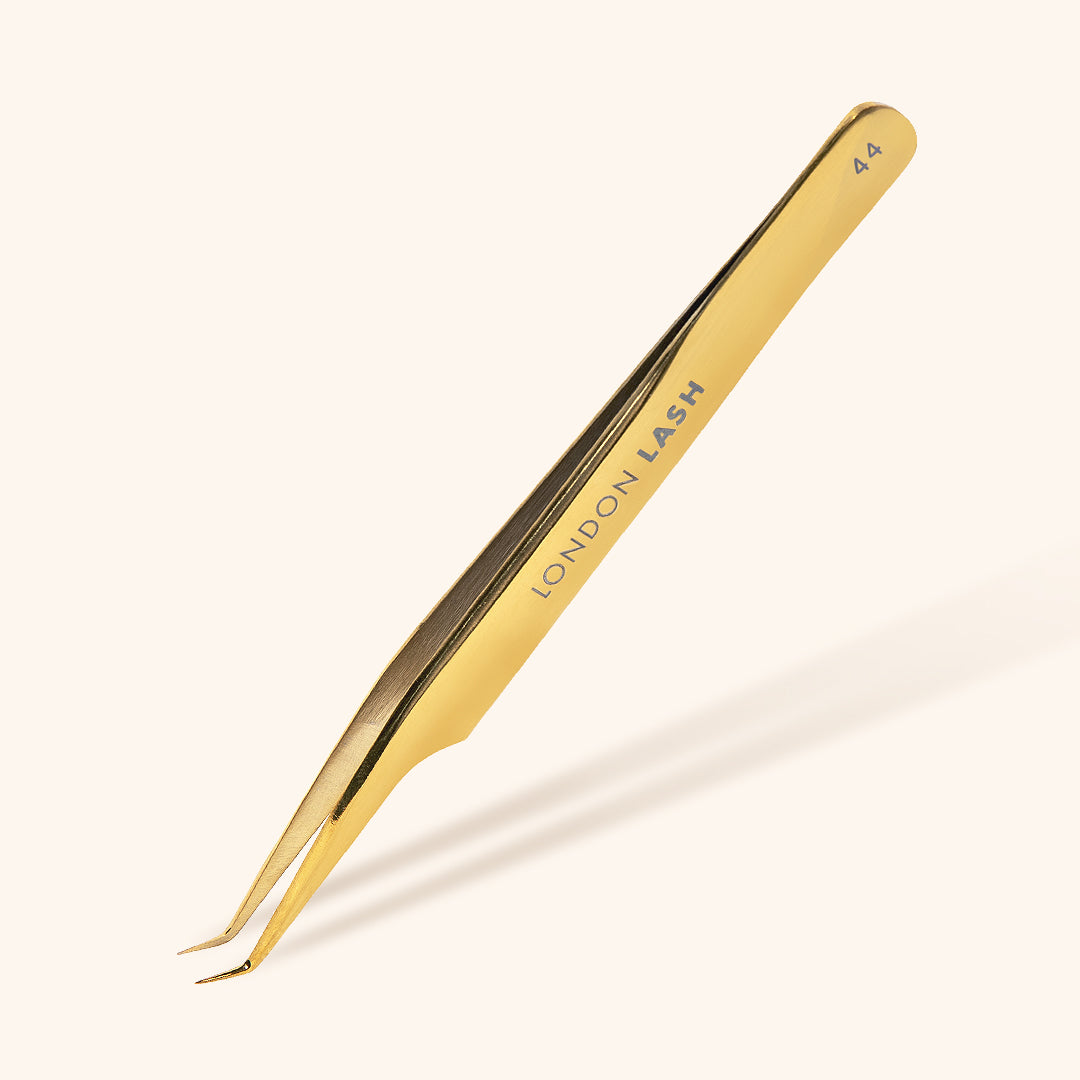 Long slim mega volume lash tweezers in gold and black