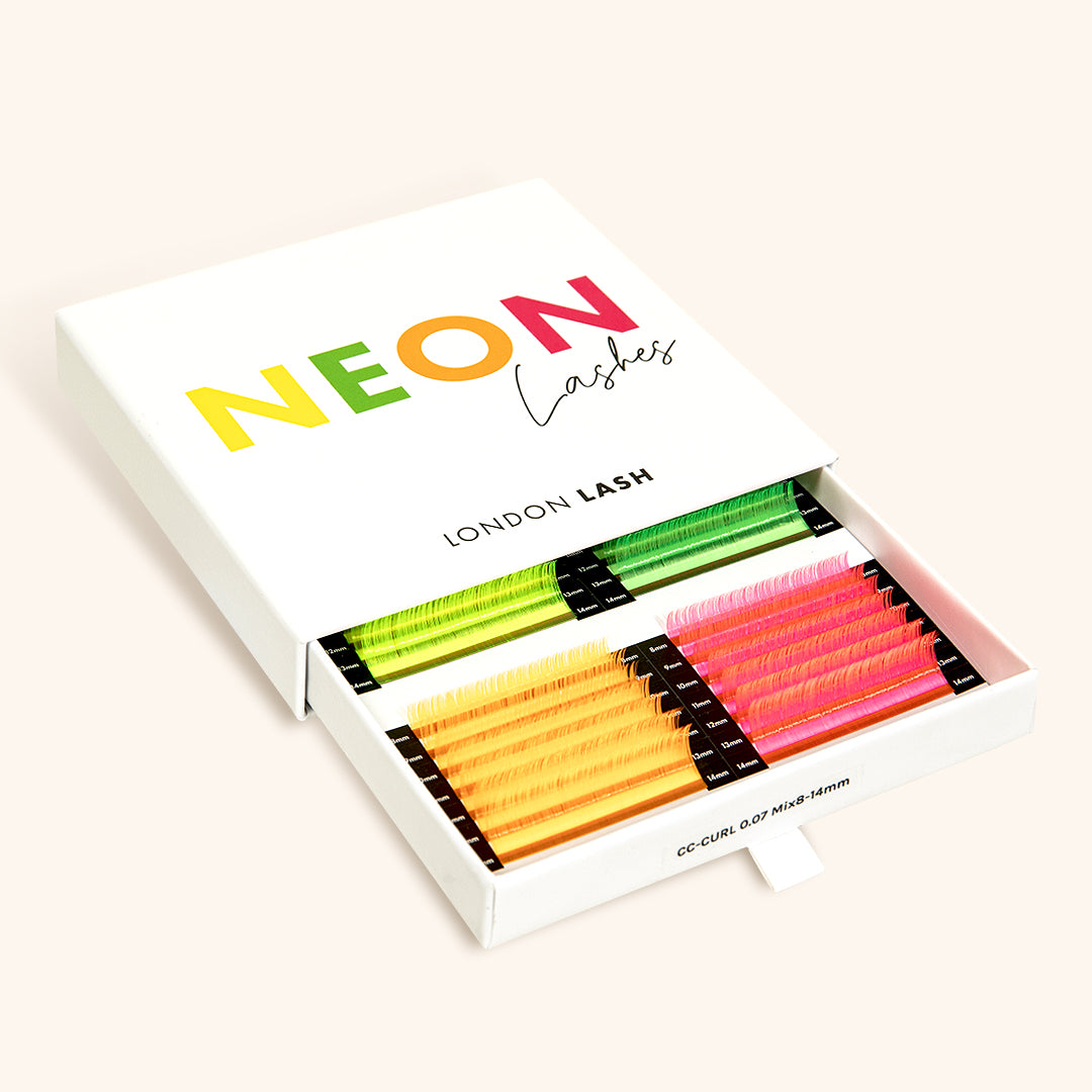 Neon eyelash extensions in four colors in a lash tray