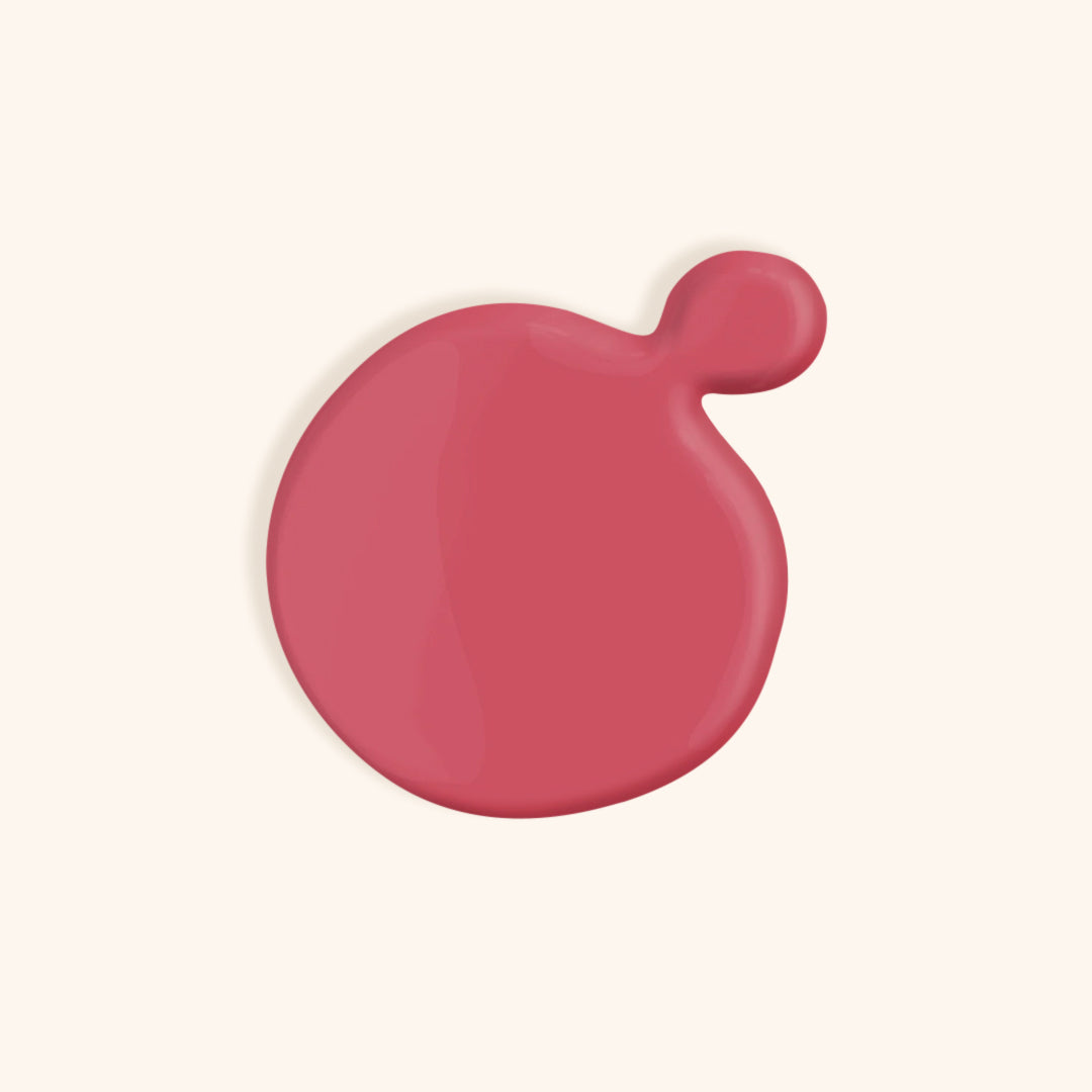 Pink gel nail polish in a white bottle