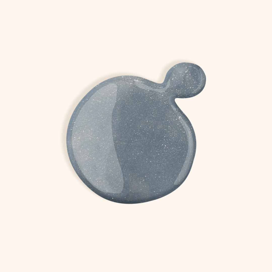 Denim glittery blue nail polish with turquoise hue