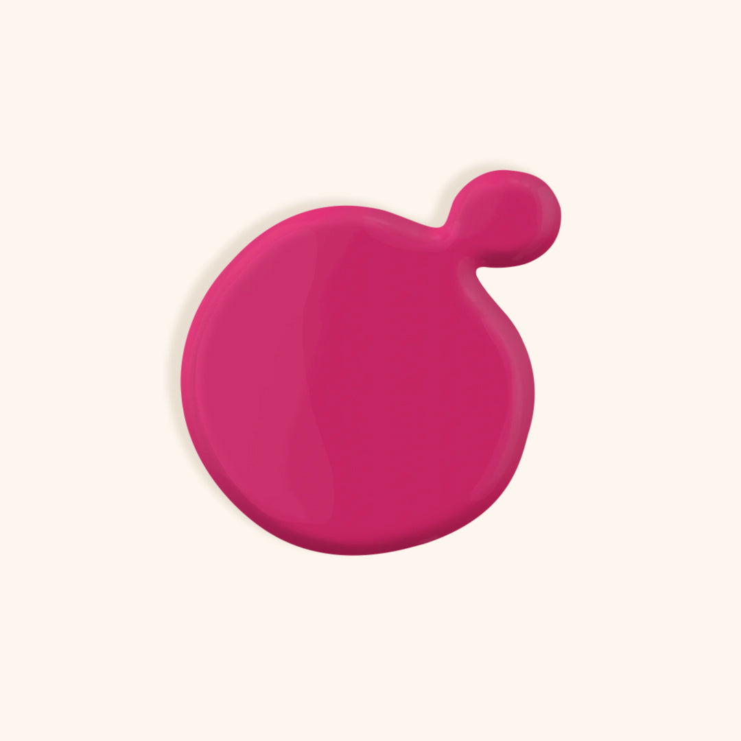 Neon Barbie pink gel nail polish in a white bottle